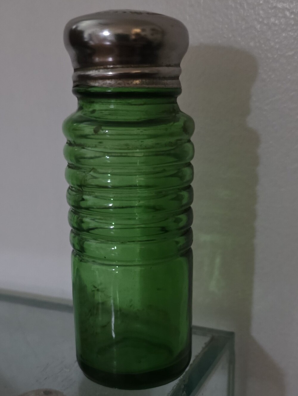 Vintage emerald-green ribbed glass salt or pepper shaker made by Owens-Illinois
